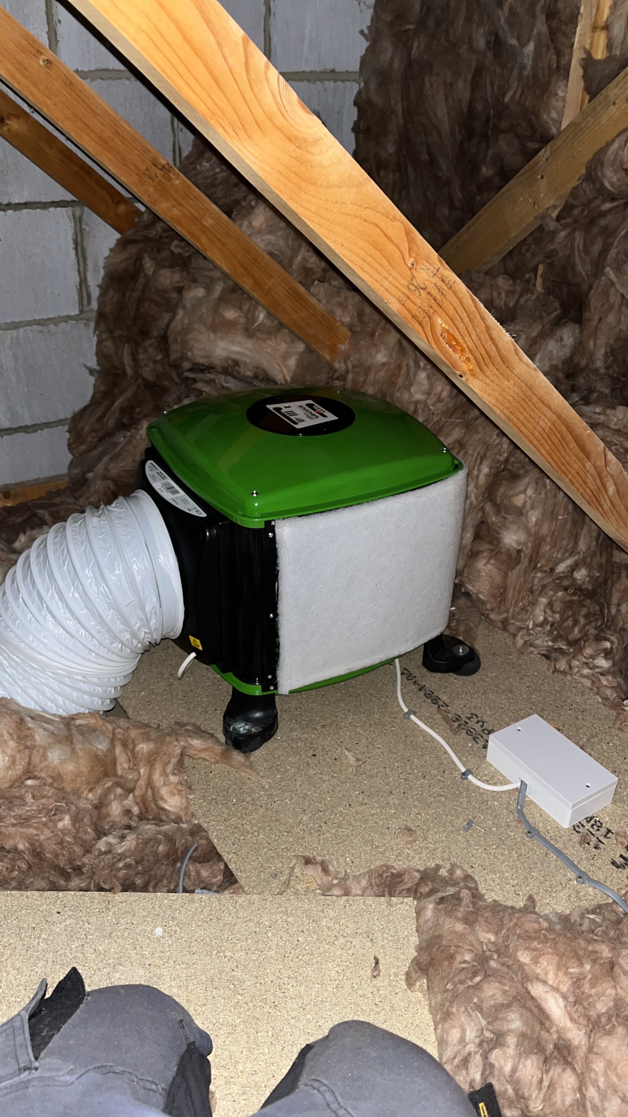 Ventilation and wiring unit installed neatly in a loft by CAN Electrical Contractors Limited, the cabling standard smoke alarm systems share